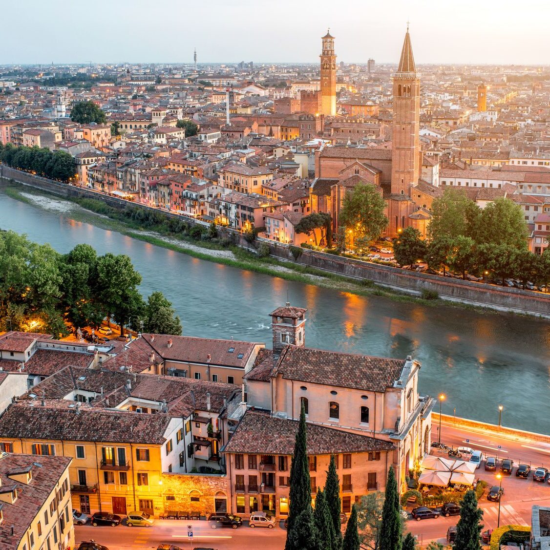 Verona panoramic aerial view on illuminated old town on the sunset in Italy